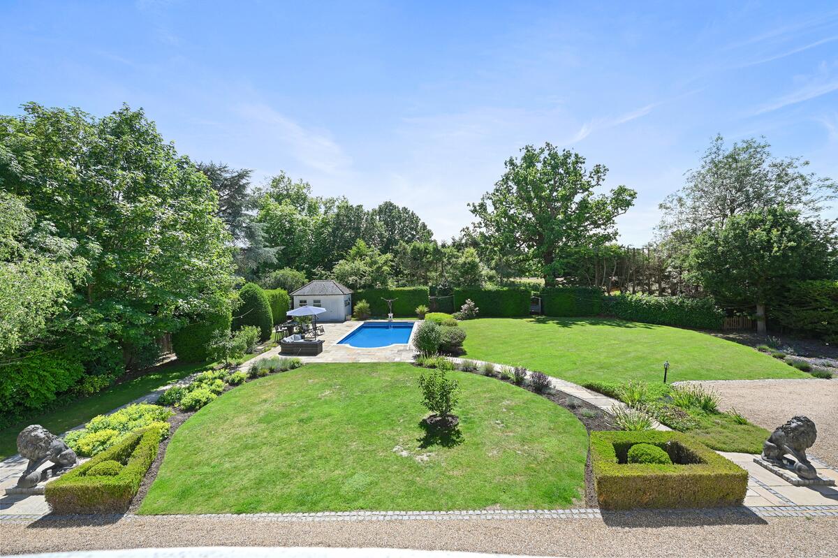 The garden from the house: lawns, box hedging, the pool and pool house