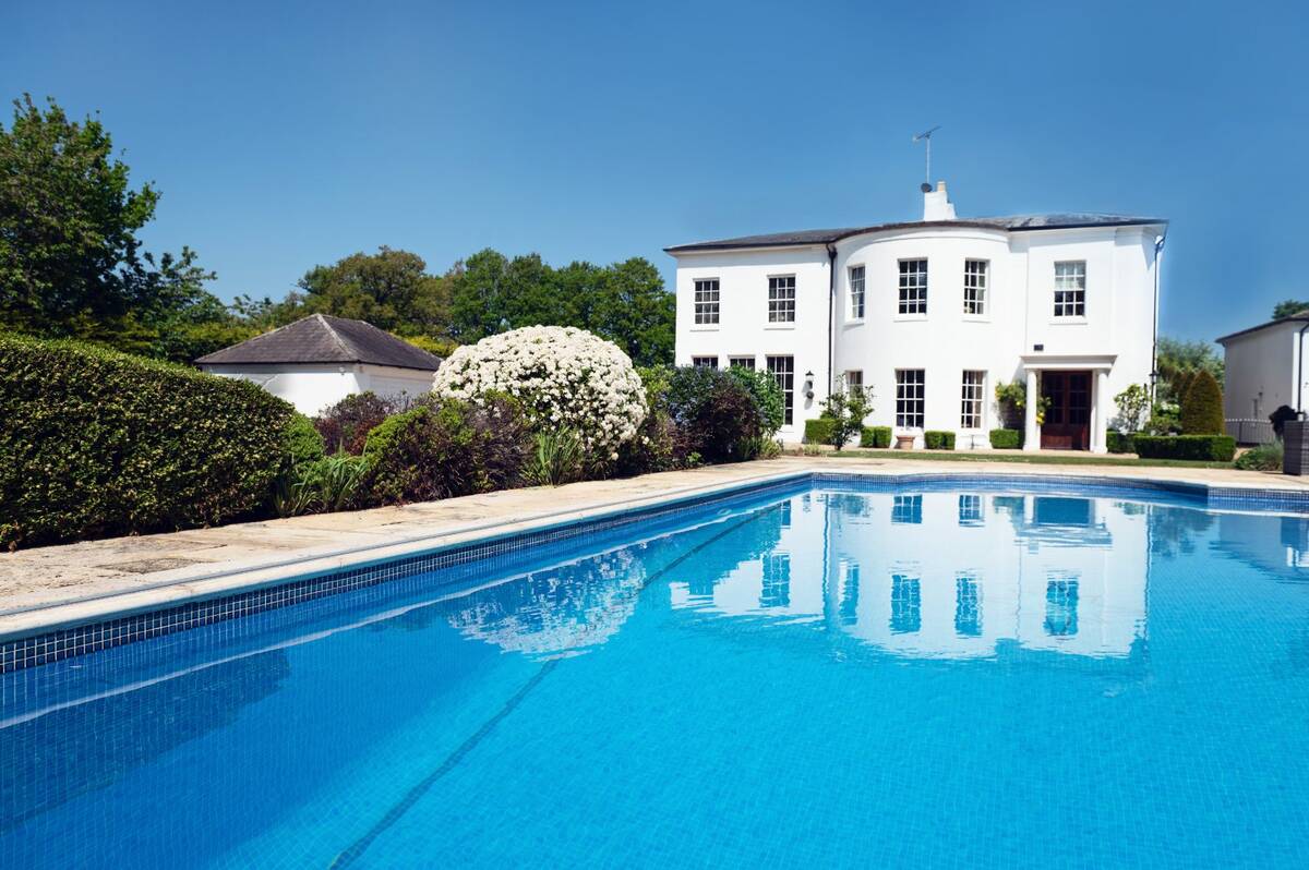 The house reflected in the pool